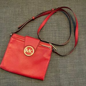 Red crossbody Michael Kors purse